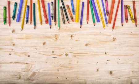 School supplies on wooden background - space for captionの写真素材