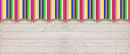 School concept - Colored pencils on wooden background. 3d illustrationの写真素材