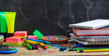Education concept - School supplies on a wooden deskの写真素材