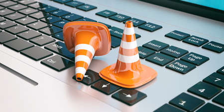Traffic cones on a computer keyboard. 3d illustration