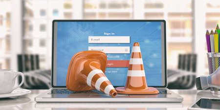 Traffic cones on a laptop -  office background. 3d illustrationの写真素材