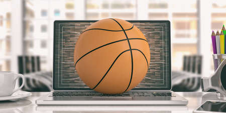 Basketball ball on a laptop - office background. 3d illustrationの写真素材