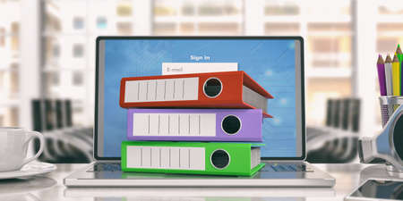 Colorful ring binders on a laptop in an office. 3d illustrationの写真素材