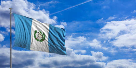 Guatemala waving flag on blue sky background. 3d illustrationの写真素材