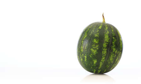 Whole single watermelon isolated on white backgroundの写真素材