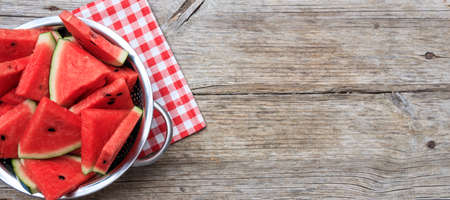 Watermelon slices on a wooden board- top viewの写真素材