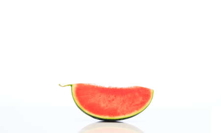Seedless watermelon slice isolated on white backgroundの写真素材