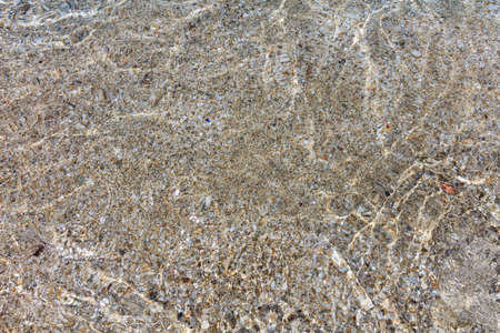 Small pebbles on the sea bed - top viewの写真素材