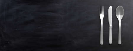 Fork, spoon and knife isolated on black background. 3d illustrationの写真素材