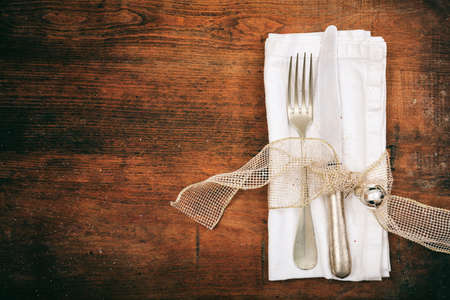 Table setting with fork and knife on wooden backgroundの写真素材
