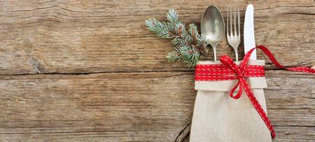 Christmas table setting with decoration on wooden backgroundの写真素材