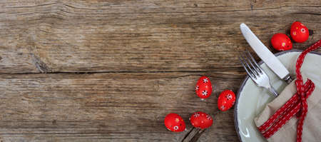Easter eggs on a plate on red backgroundの写真素材