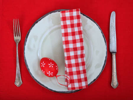 Easter eggs on a plate on red background
