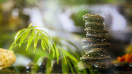 Zen stones stacked on abstract nature backgroundの写真素材