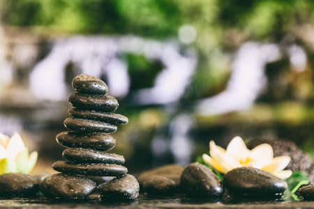 Zen stones stacked on abstract nature backgroundの写真素材