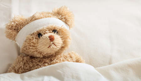 The child is sick concept.Teddy bear in the hospitalの写真素材