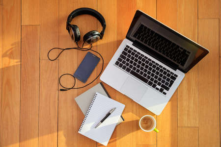 Modern workspace on the wooden floor, at home. Top viewの写真素材