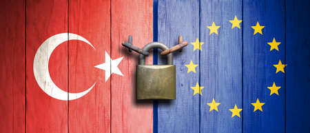 Turkey and EU relations.Turkey and European Union flags on wooden door with padlock. 3d illustrationの写真素材
