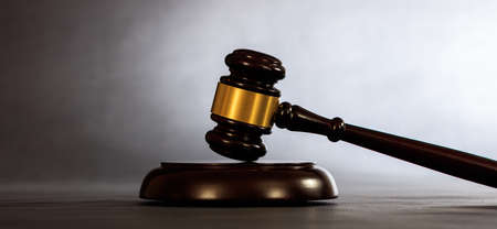 Law or auction gavel on a dark background, copy spaceの写真素材