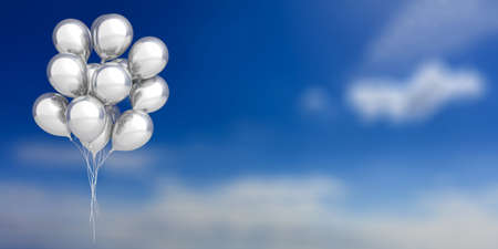 Group of silver party balloons on blue sky background. 3d illustrationの写真素材