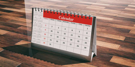 Desk calendar isolated on wooden background. 3d illustrationの写真素材