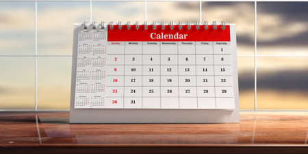 Desk calendar isolated on a wooden table, abstract sky background. 3d illustrationの写真素材