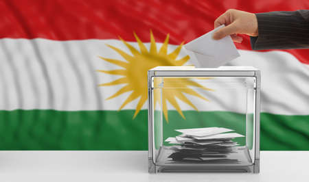Elections in Kurdistan. Man's hand puts an envelope in a glass election ballot box on a waving Kurdistan flag background. 3d illustrationの写真素材