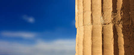 Greek marble pillar detail on blue sky background, copy spaceの写真素材
