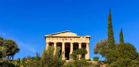 Athens, Greece. Hephaestus temple in ancient Agora on blue sky backgroundの写真素材
