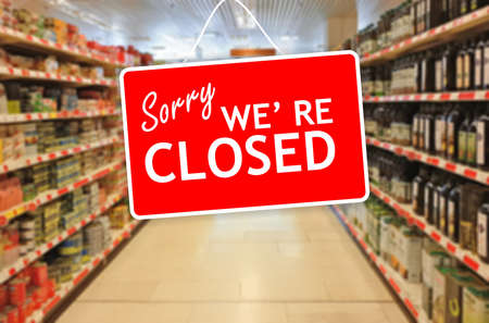 Sorry we are closed label on a blur Supermarket backgroundの写真素材