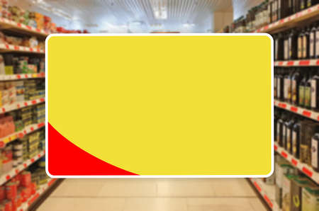 Yellow blank label on a blur Supermarket backgroundの写真素材