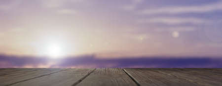 Wooden table and sky background at sunset. 3d illustrationの写真素材