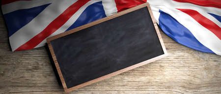 UK crumpled flag placed on wooden background. Blackboard in frame with copyspace. 3d illustrationの写真素材