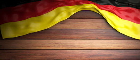Germany crumpled flag placed on wooden background with copyspace. 3d illustrationの写真素材