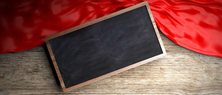 Red crumpled fabric placed on wooden background. Blackboard in frame with copyspace. 3d illustrationの写真素材