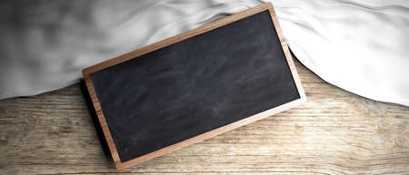 White crumpled fabric placed on wooden background. Blackboard in frame, copyspace. 3d illustrationの写真素材