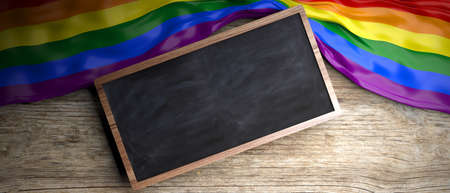 Gay crumpled flag placed on wooden background. Blackboard in frame with copyspace. 3d illustrationの写真素材