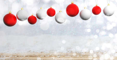 Red and white Christmas balls on wooden background with snow, copy space. 3d illustrationの写真素材