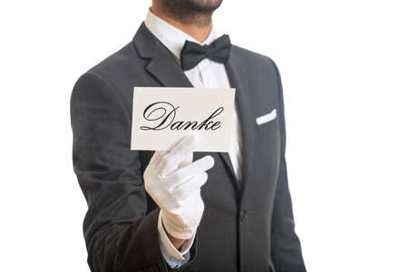 Thank you concept. Waiter holding a Thank you card on white background,の写真素材