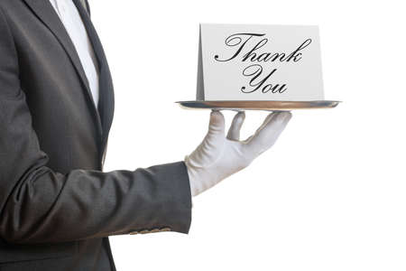 Thank you concept. Waiter offering a tray with a Thank you card,の写真素材