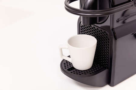Espresso coffee maker machine with modern design. White background, close up view with details.の写真素材