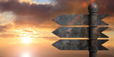 Blank metal arrow signposts on metal pole, isolated on sunrise or sunset background. 3d illustrationの写真素材
