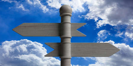 Blank wooden arrow signposts on pole, isolated on blue sky background. 3d illustrationの写真素材