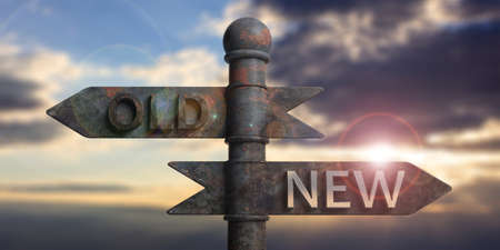 Old and new written on signposts isolated on sky at sunset or sunrise background. 3d illustrationの写真素材
