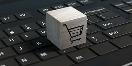 Online shopping concept. Shopping trolley on a cube on a black computer keyboard. 3d illustrationの写真素材