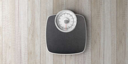 Weight control concept. Bathroom scale isolated on wooden background, top view, banner. 3d illustrationの写真素材