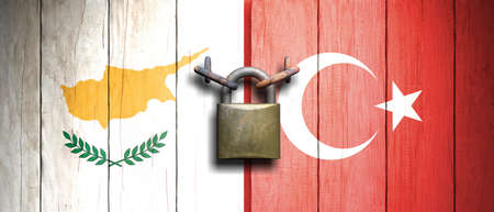 Cyprus and Turkey relations. Turkey and Cyprus flags on wooden door with padlock. 3d illustrationの写真素材