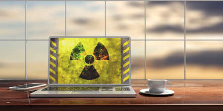 Radiation symbol on a laptop screen, blur sunset or sunrise background. 3d illustrationの写真素材