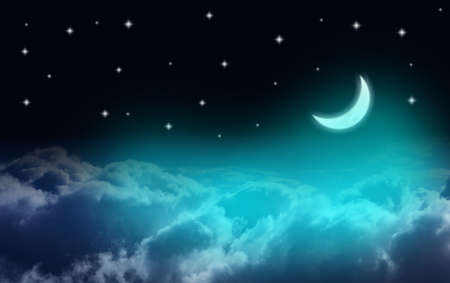 Waxing crescent moon over clouds in a starry nightの写真素材