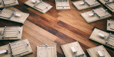 Empty mouse traps on wooden floor, space for text. 3d illustrationの写真素材